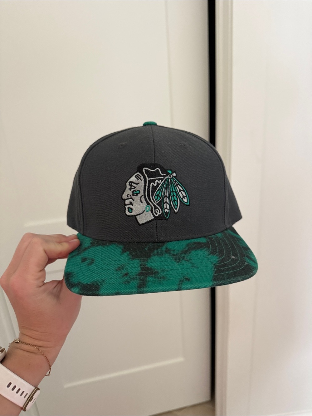 NHL Gray Snapback Hat with Teal Brim and Feather Logo